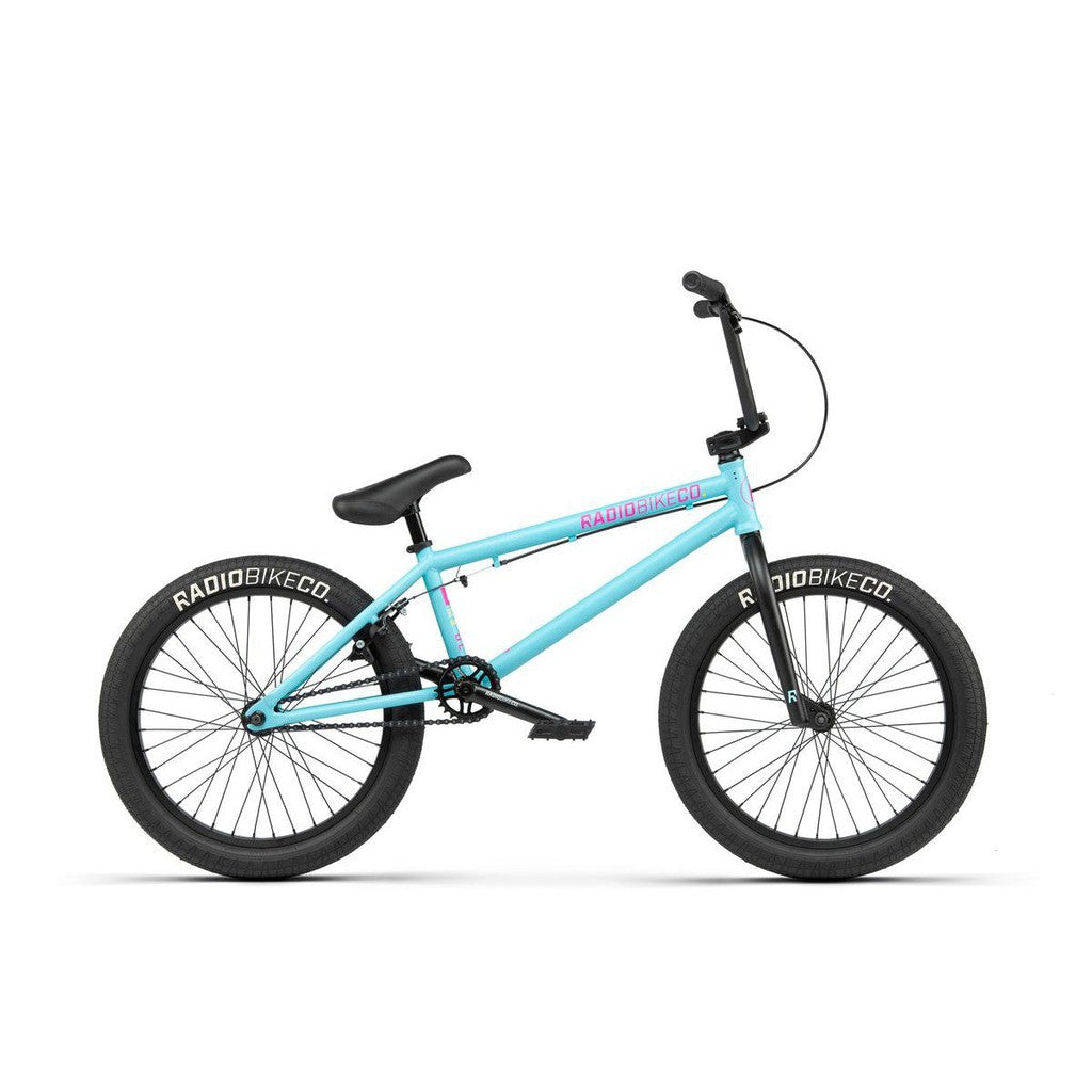 A blue BMX bike with black tires and handlebars, featuring "Radiobike" branding on the frame. The Radio Evol 20 Inch Bike boasts high-quality bike parts, offering a sturdy build and sleek design ideal for beginner riders.
