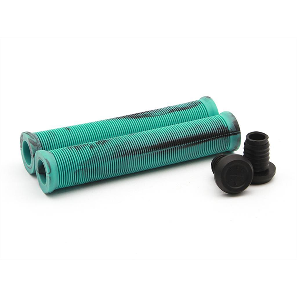 The Radio Login XL Grips, crafted from durable Kraton rubber in turquoise with a ribbed profile and black accents, lie on a surface alongside two small black bar end plugs.