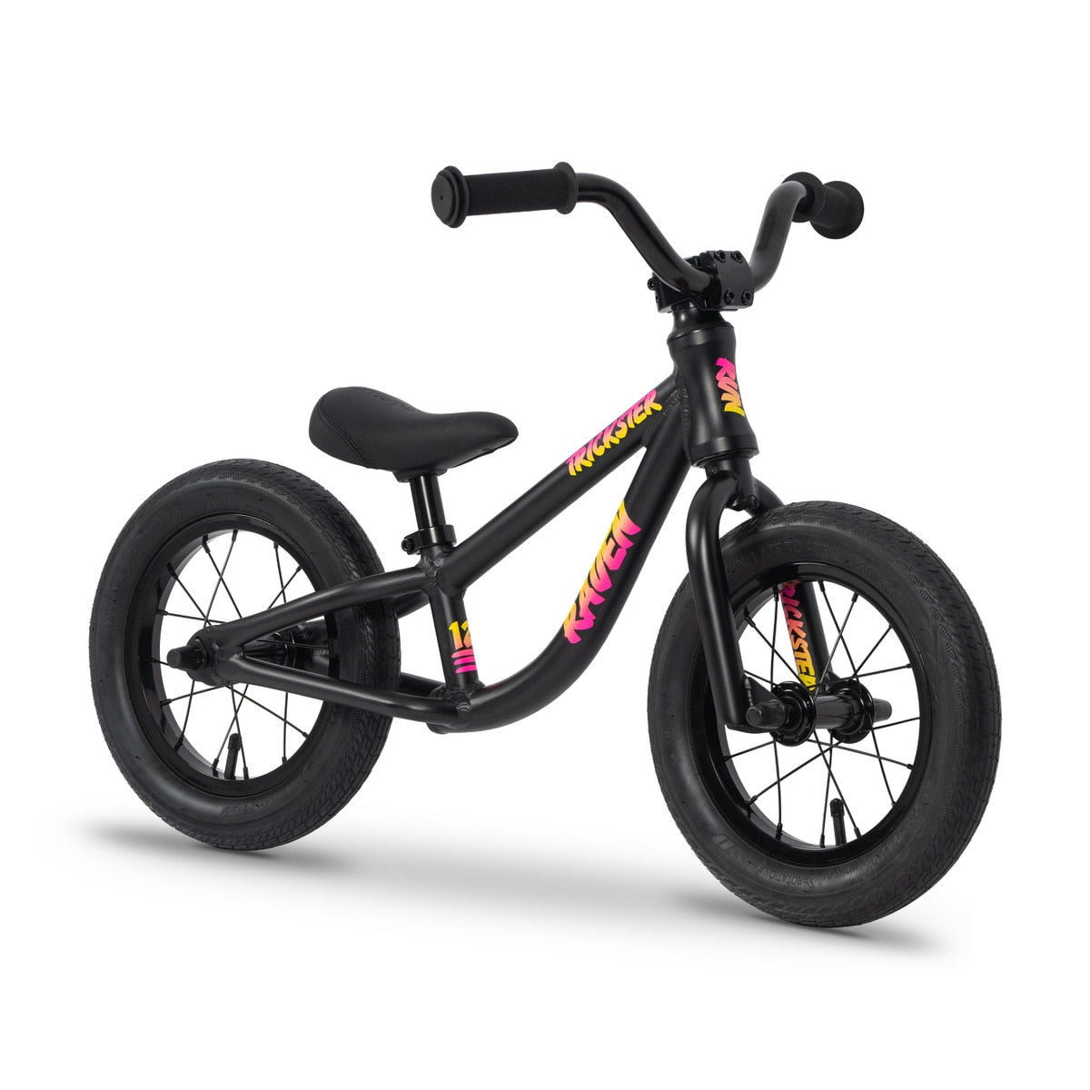 The Raven Trickster Alloy 12 Inch Balance Bike is a black kids' bike with thick tires, sealed bearings for smooth rides, no pedals, and features colorful "Krusher" graphics on the frame and fork.