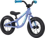 The Raven Trickster Alloy 12 Inch Balance Bike features a lightweight purple alloy frame, black tires, turquoise handlebar grips, and "RAVEN" displayed on the side.