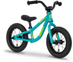 The Raven Trickster Alloy 12 Inch Balance Bike features a turquoise lightweight alloy frame, black handlebars, seat, and tires, with yellow "Raven" branding on the frame.