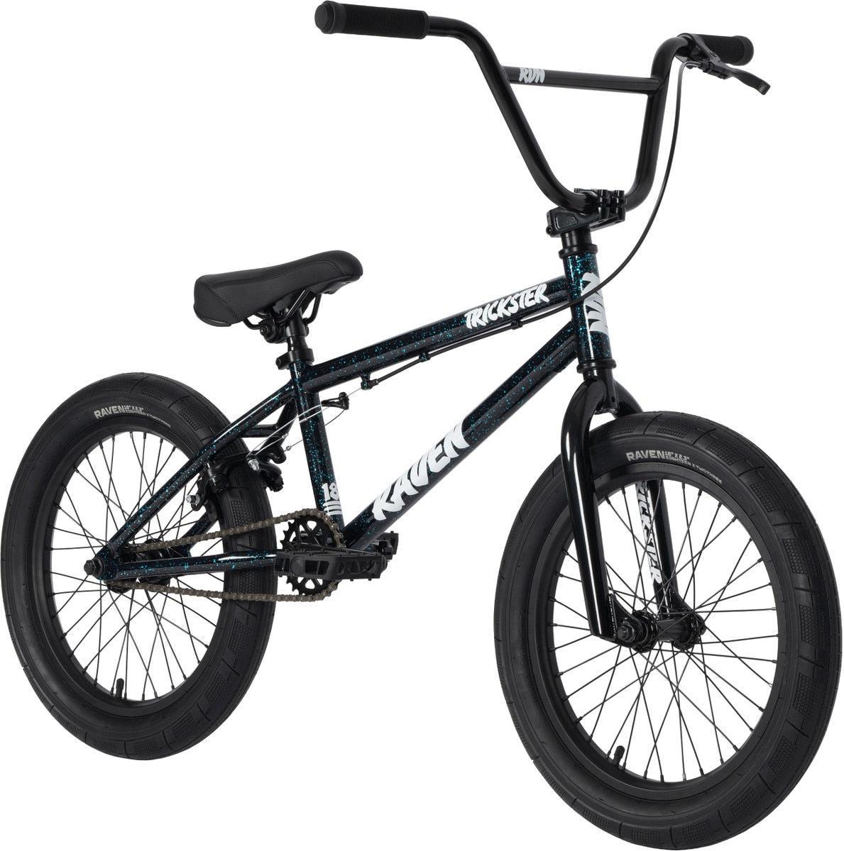 The Raven Trickster 18 Inch Bike, featuring a black and blue frame, thick tires, chromoly cranks, padded seat, and high handlebars, is displayed against a white background.