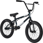 The Raven Trickster 18 Inch Bike, featuring a black and blue frame, thick tires, chromoly cranks, padded seat, and high handlebars, is displayed against a white background.