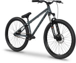 The Raven Onyx 26 Inch Dirt Jumper Bike, featuring a gray Chromoly frame, thick black tires, front suspension fork, flat handlebars, single gear, and disc brakes, is displayed on a white background.