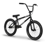 The Raven Trickster 20 Inch Bike is a black entry-level BMX with thick tires, rear axle pegs, and bold “Trickster” and “Raven” branding on the frame—perfect for beginner BMX riders. Shown on a white background.