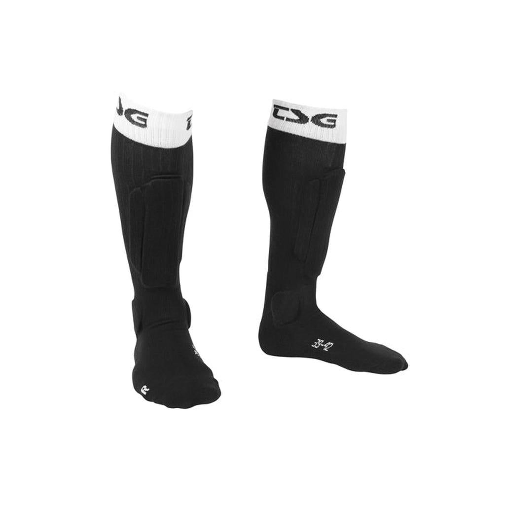 The TSG Riot Socks are black knee-high socks with white cuffs, featuring foam padding for extra protection on the shins and ankles.