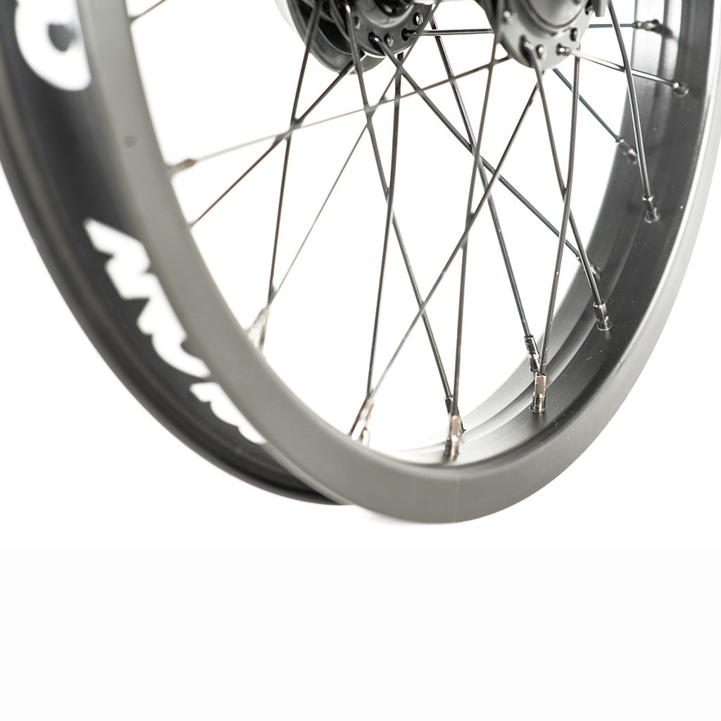 A close up image of a Colony Pintour 16 Inch Rear Wheel with spokes.