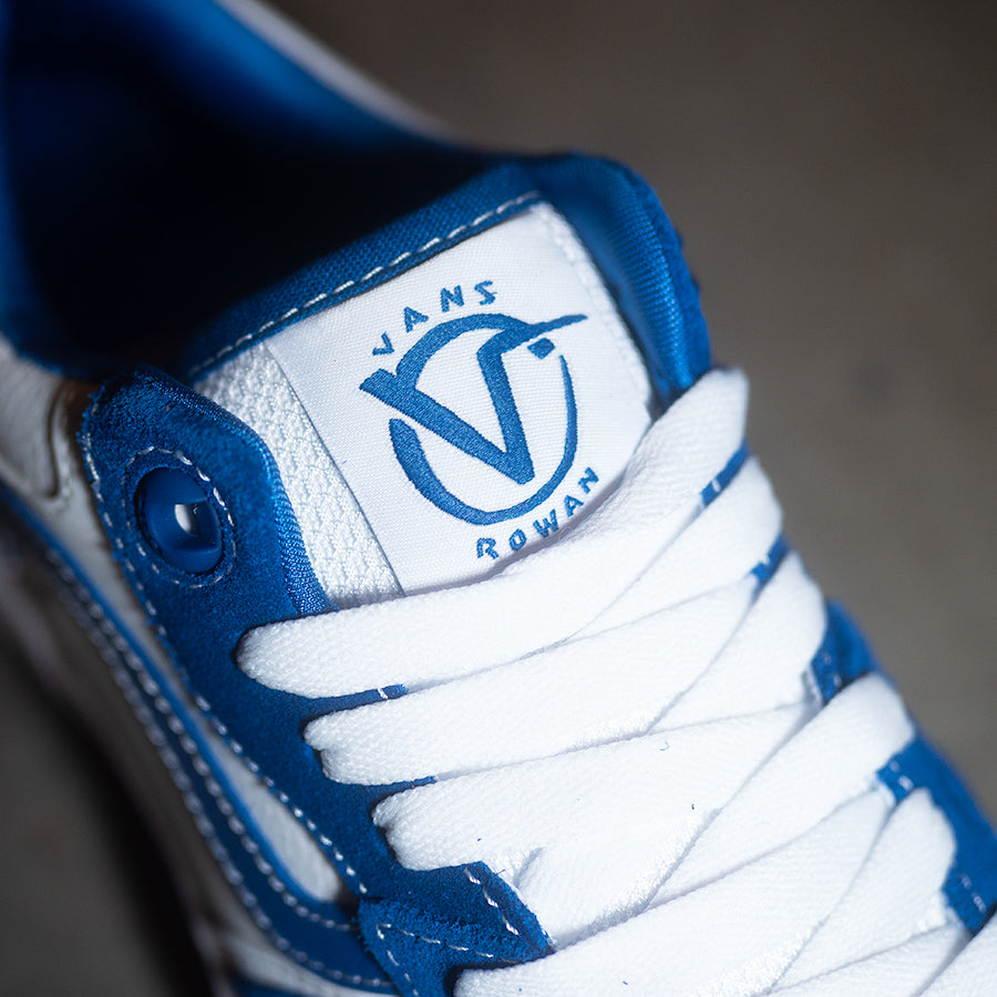 A pair of blue and white Vans Rowan 2 Shoes - True Blue/White with the Vans logo on them.