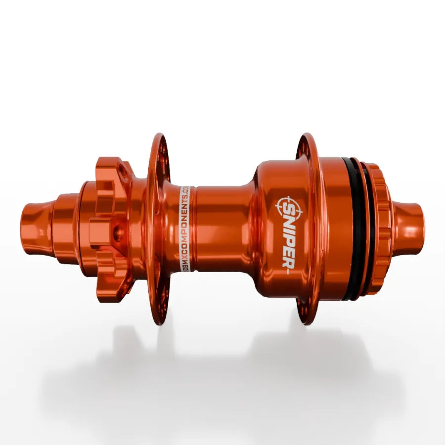 The SD-X Sniper Evo Air Expert 10mm Rear Hub (28 Hole), in orange metallic, is shown on a white background highlighting its flanges, axle housing, and machined lightweight design for instant engagement.
