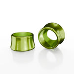 Two green, cylindrical SD-X Sniper Evo 10mm Bolt Caps made from 7075 aluminum are displayed on a white background, with one standing upright and the other lying on its side.