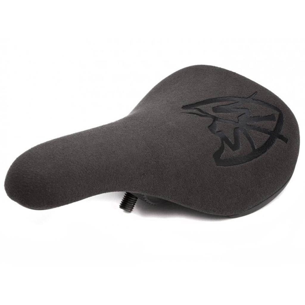 The S&M Stealth Slim Pivotal Seat features a black ergonomic design with a textured microfiber surface and an abstract logo on the rear, inspired by the Stealth Pivotal seat.