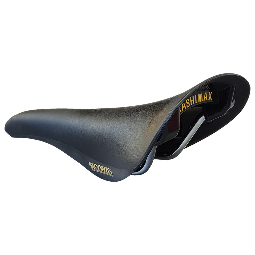 A black Kashimax Aero BMX AMX-C Railed Seat, made in Japan, with “Kashimax” printed in yellow on the side and underside, featuring metal rails for mounting.