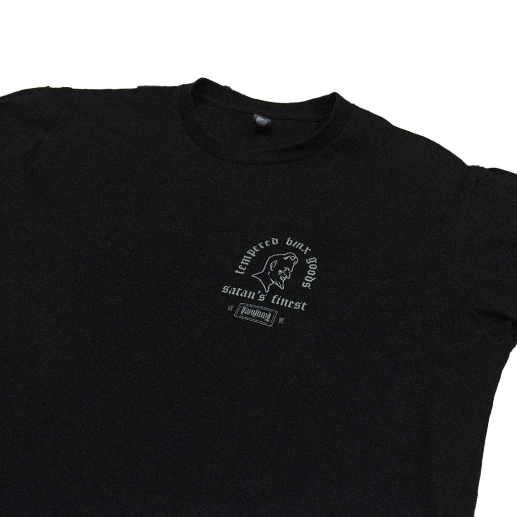 Explore our Tempered Goods Satan's Finest Tee, a handmade black T-shirt adorned with a captivating front graphic and white text.