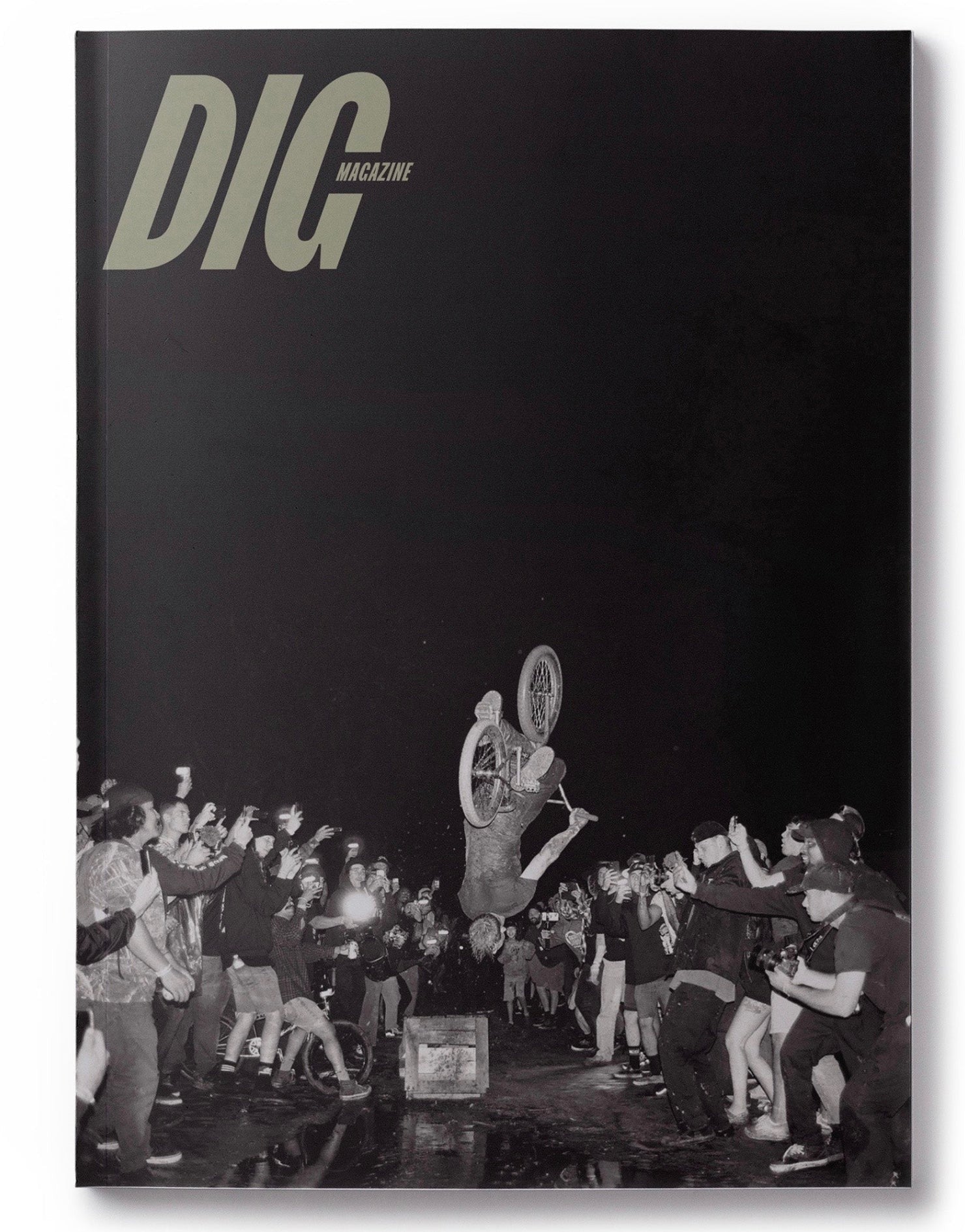 The cover of DIG Book 2021 - Photo Annual featuring a man riding a bike at Swampfest, issue #2021.