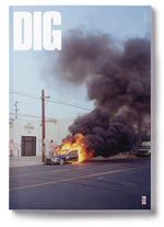 The explosive cover of DIG Book 2020 - Photo Annual showcases a blazing car, leaving viewers captivated by the daring image.