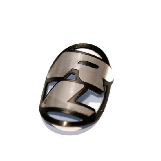The Redline Headtube Badge is a metallic emblem with a stylized "RZ" on white, ideal for retro rebuilders searching for authentic or new old stock Redline head badges.