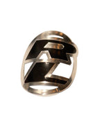 The Redline Headtube Badge is a silver ring featuring a bold, stylized "R" design inspired by classic Redline head badges—a must-have accessory for midschool rebuilders and retro fans, shown against a white background.