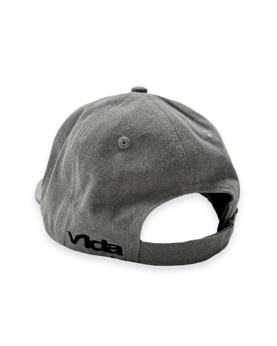 The V1da Shoreline Cap is a gray strapback made from 100% cotton, seen from the back and adorned with black embroidered "vida" near the edge.