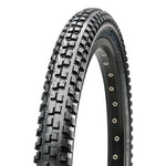 Close-up of the Maxxis Maxx Daddy 20 Inch Tyre, a black tire with a knobby tread pattern, designed for dirt jumping and off-road or mountain biking.