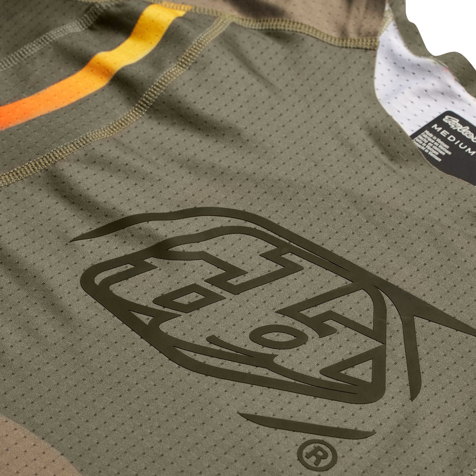 A close up of a TLD Sprint Ultra Jersey Pinned Olive featuring Ultra Knit fabric.