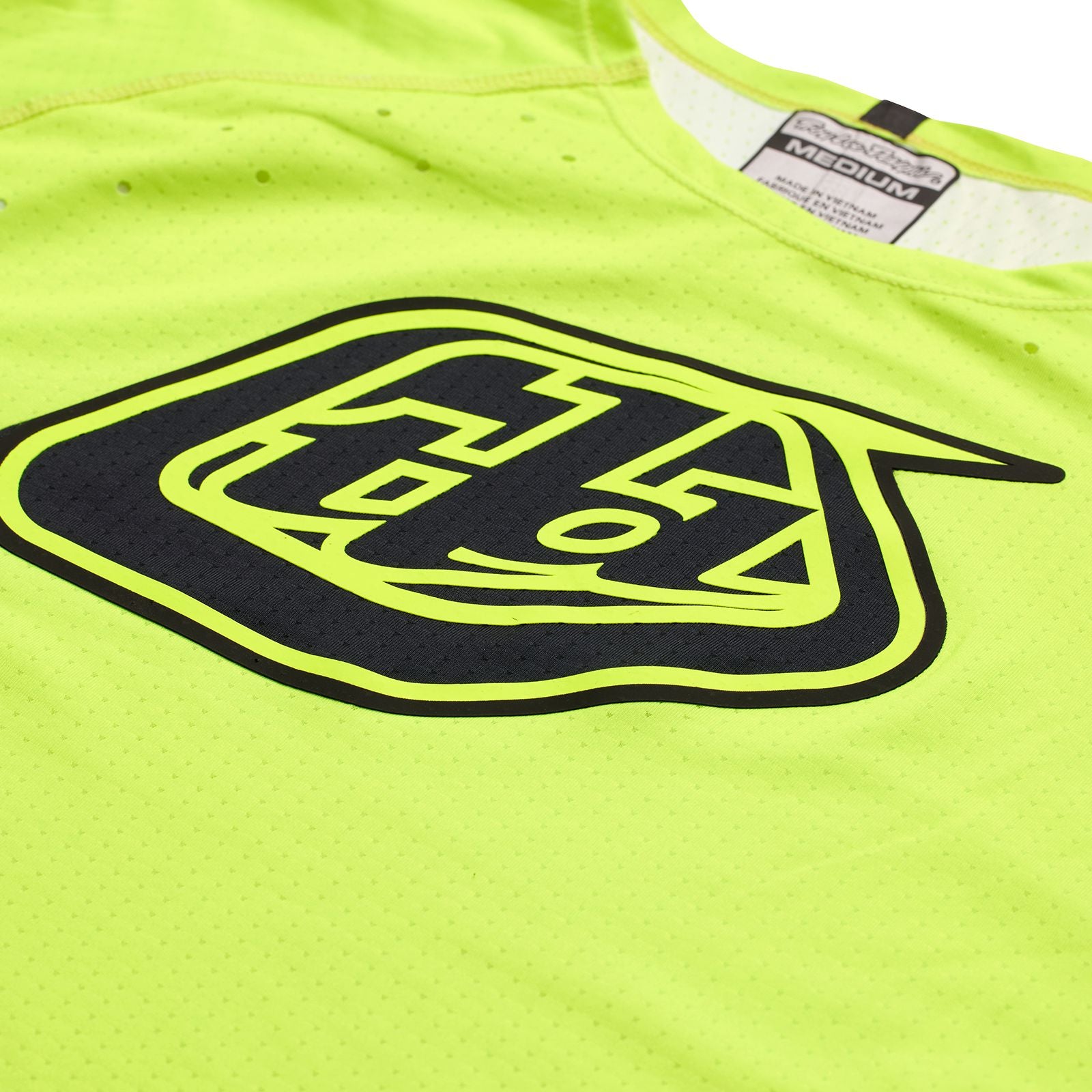 A close up of a yellow TLD Sprint Ultra Jersey Sequence Flo Yellow.