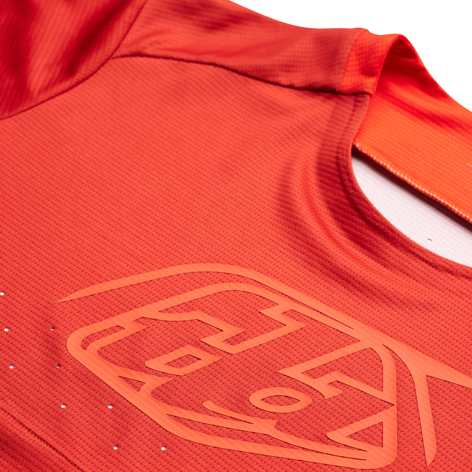 A close up of a red TLD Sprint Jersey Icon Fire Orange.