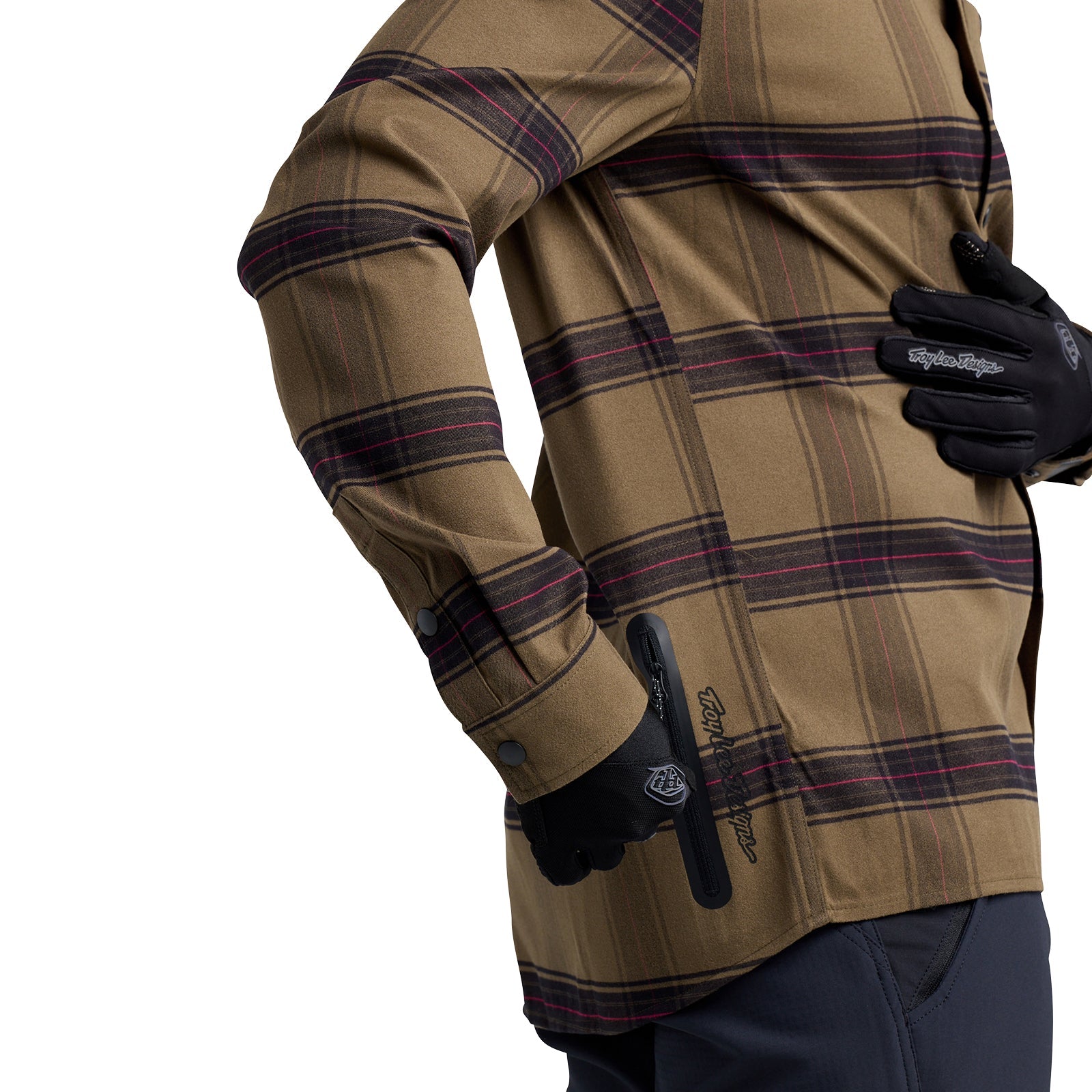Person wearing a TLD 24.2 Grind Flannel Shirt and gloves, holding a tool at their side.