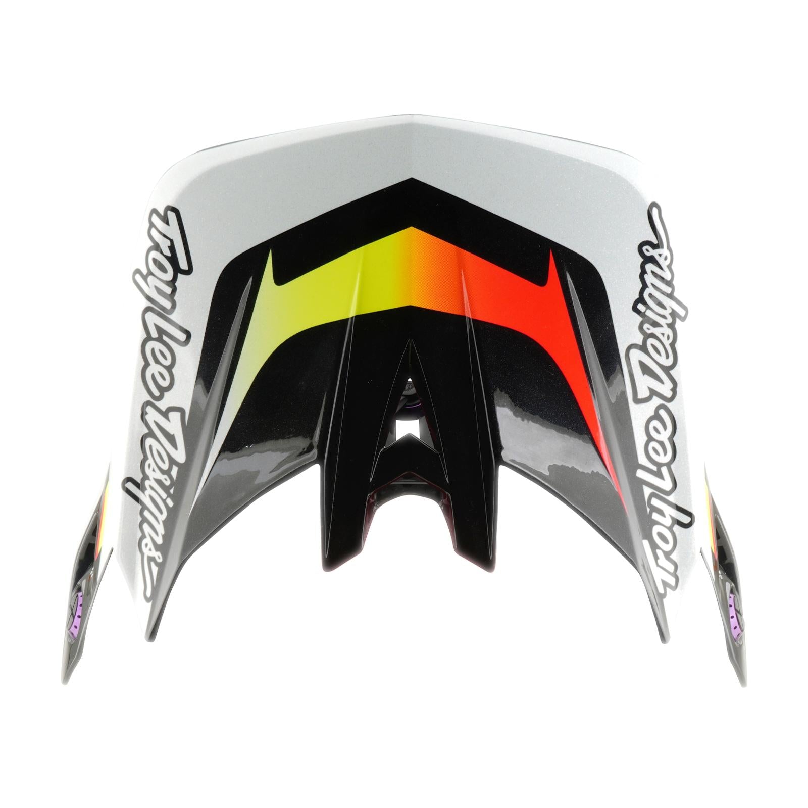 A TLD 26.1 D4 AS Carbon Helmet visor with the Troy Lee Designs logo on both sides and a lined-up black, yellow, orange, and red graphic pattern in the center.