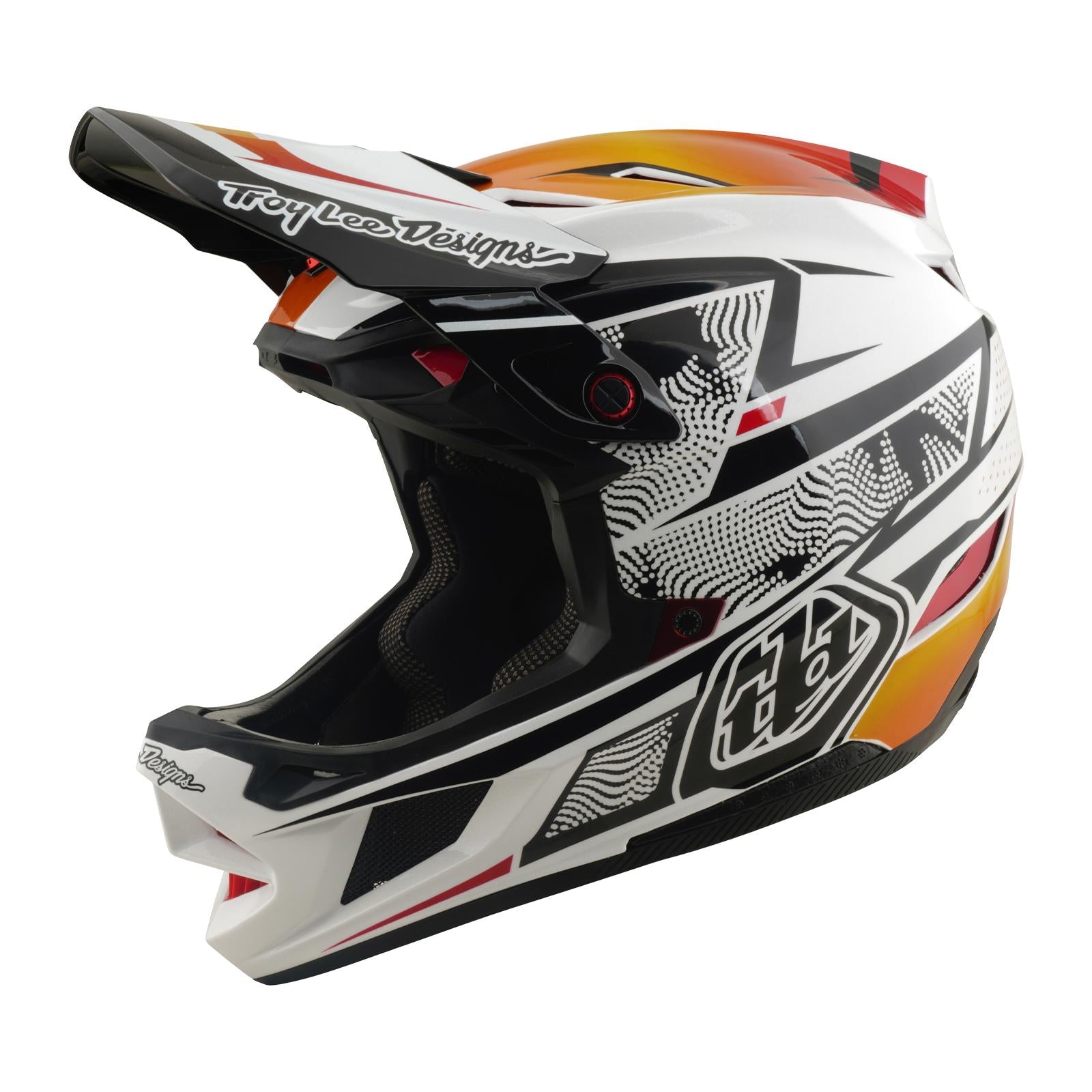 The TLD 26.1 D4 AS Composite Helmet / Lined Up White is a white, black, and orange motocross helmet with geometric graphics, visor, "Troy Lee Designs" logo, and Mips protection system for BMX safety.