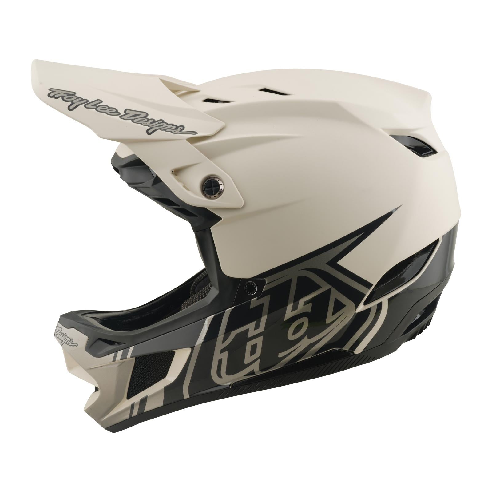 The TLD 26.1 D4 AS Composite Helmet in Stealth Pumice is a matte white and black full-face motocross helmet with geometric graphics, visor, and Mips protection system for advanced safety, shown here in a side profile view.