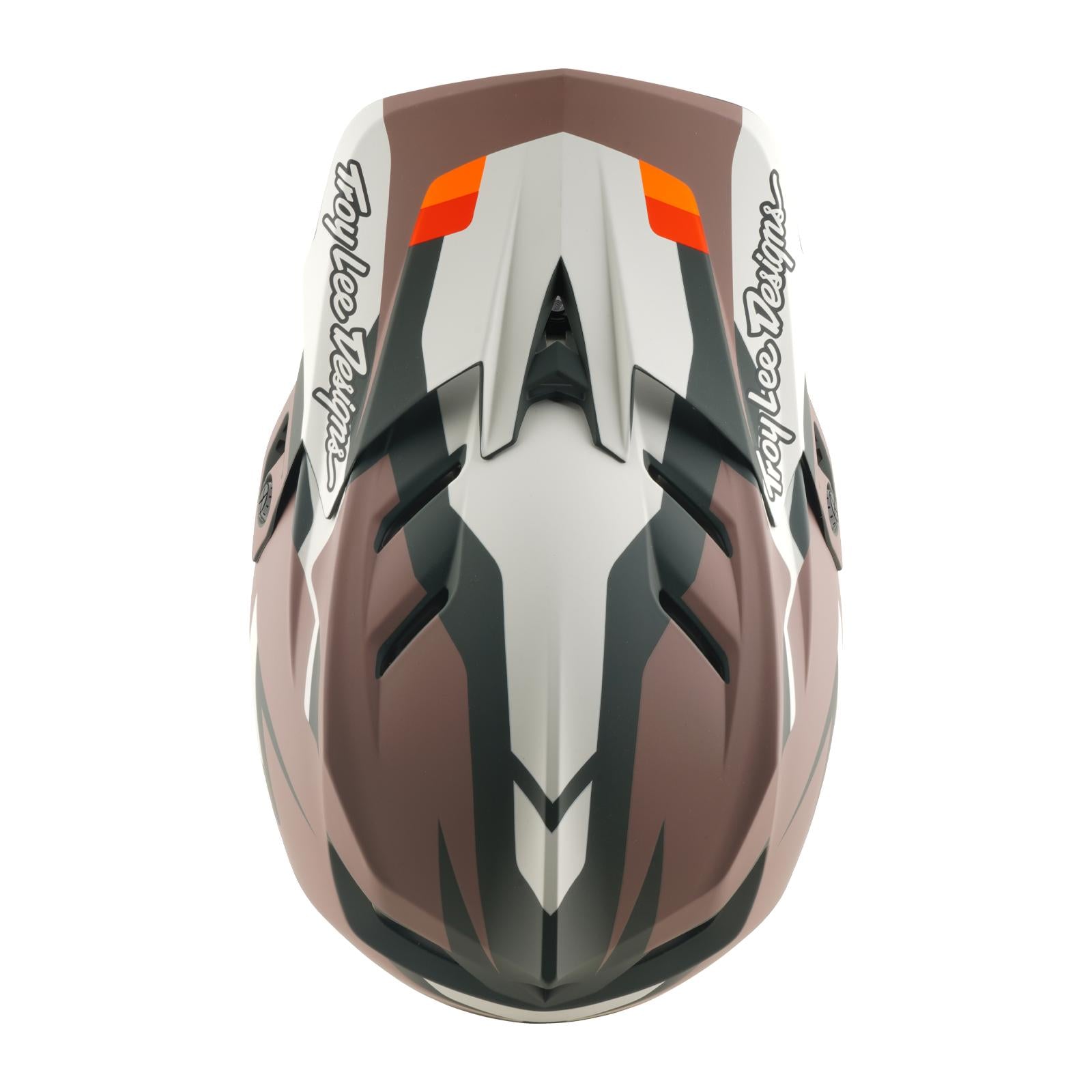 The TLD 26.1 D4 AS Polyacrylite Helmet in Roamer Clay features a brown, white, and black full-face design with "Troy Lee Designs" on both sides and Mips protection—perfect for mountain biking.