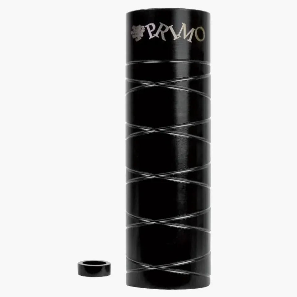 A cylindrical black metal container with silver diagonal lines, featuring the word “PRYMO” on top and a detached round cap beside it—evoking the sleek design and sturdy construction of Primo Master Pegs built for a 14mm axle.