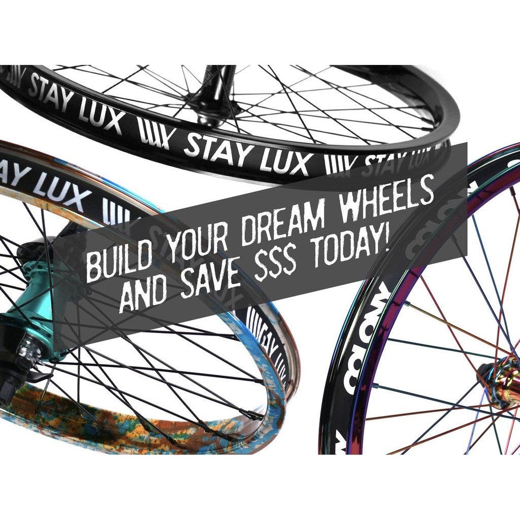 Three bicycle wheels with "BUILD YOUR DREAM WHEELS AND SAVE $$$ TODAY!" overlaid in white on a semi-transparent gray background, showcasing expertly LUXLAB built wheels and half-price labor for your WKSP Custom Wheel Build - Purchased: All Parts.