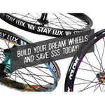 Three bicycle wheels with "BUILD YOUR DREAM WHEELS AND SAVE $$$ TODAY!" overlaid in white on a semi-transparent gray background, showcasing expertly LUXLAB built wheels and half-price labor for your WKSP Custom Wheel Build - Purchased: All Parts.