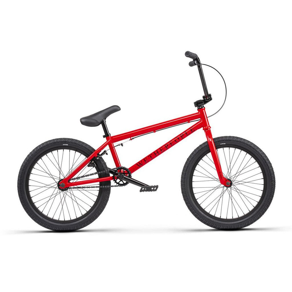 A stylish red Wethepeople Thrillseeker 20 Inch Bike on a white background.