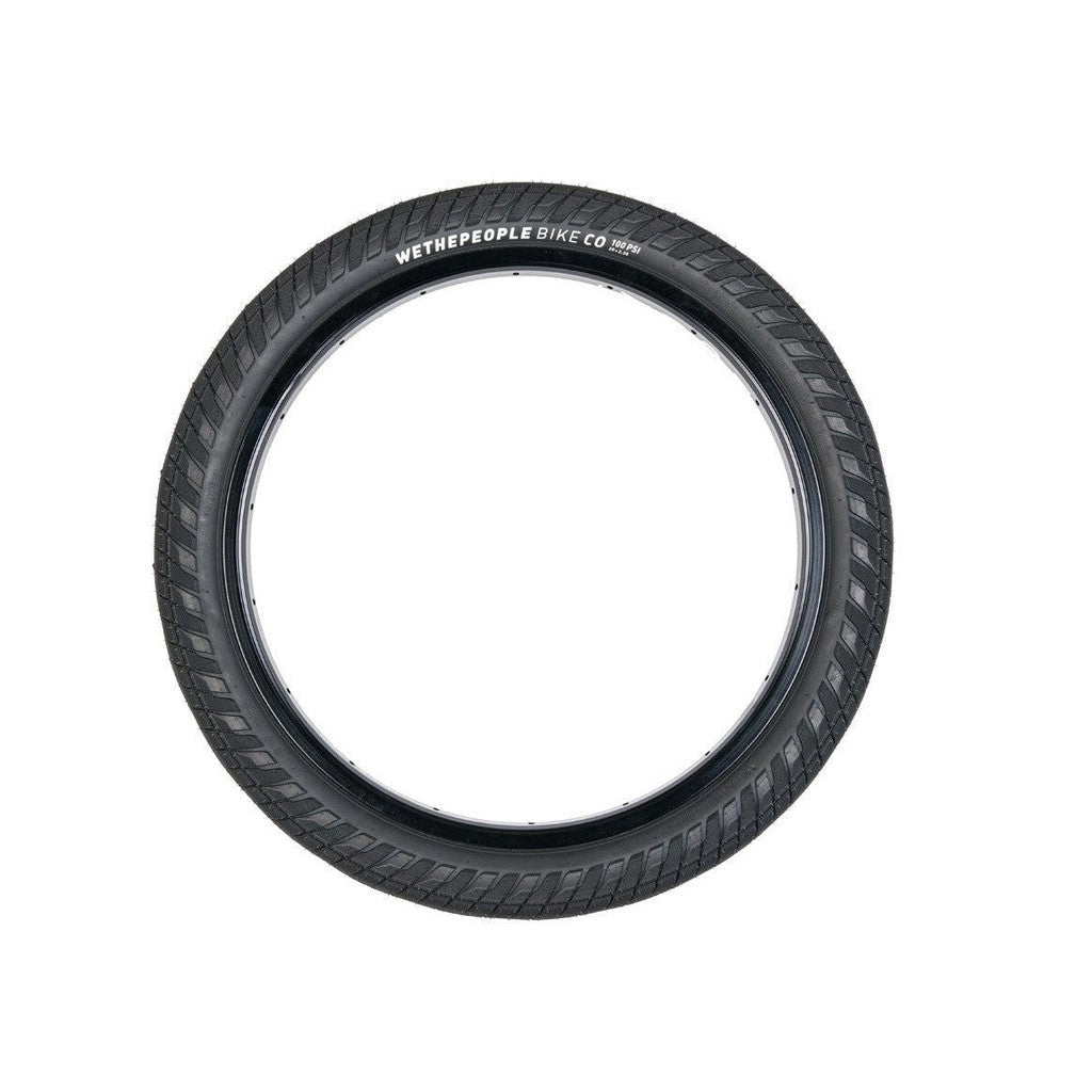 A single black Wethepeople Overbite Tyre (20x2.35) with micro knurled tread and "WETHEPEOPLE BIKE CO" text on the side, displayed on a white background. This all-rounder tire features a durable sticky compound for enhanced performance.