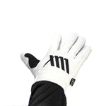 A pair of white LUXBMX X FIST gloves with a black logo on them.