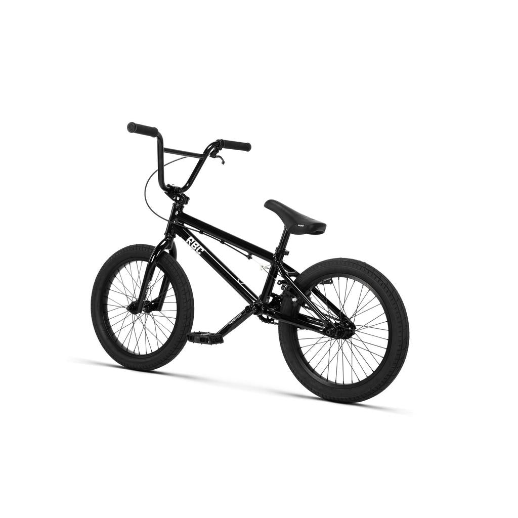 The Radio Dice 18 Inch Bike, in black, features Salt Tracer Tyres, a reinforced frame, and upright handlebars. The bike is positioned at an angle against a plain white background.