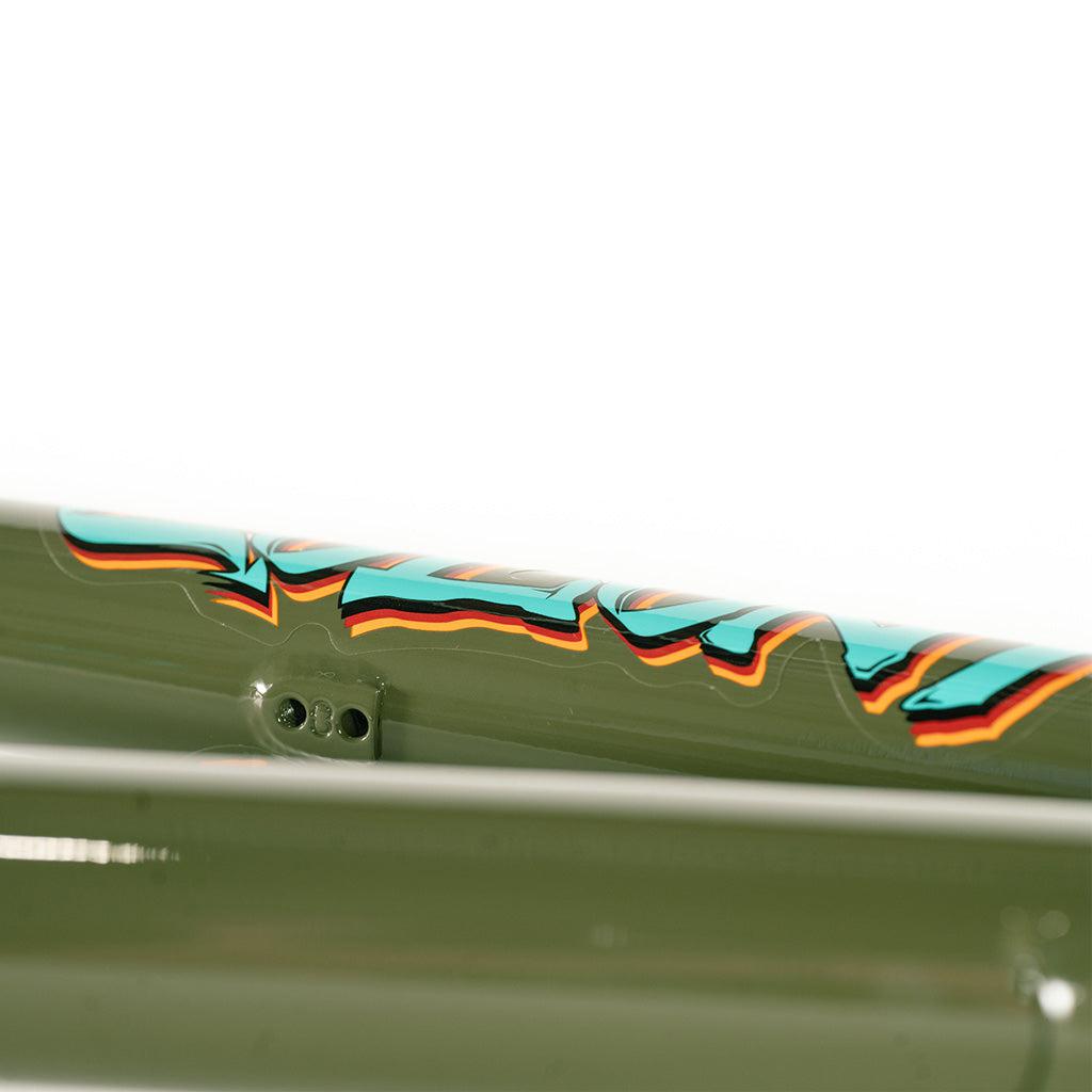 A close up of a Colony 2024 Sweet Tooth 18 Inch BMX bike frame with graffiti on it.