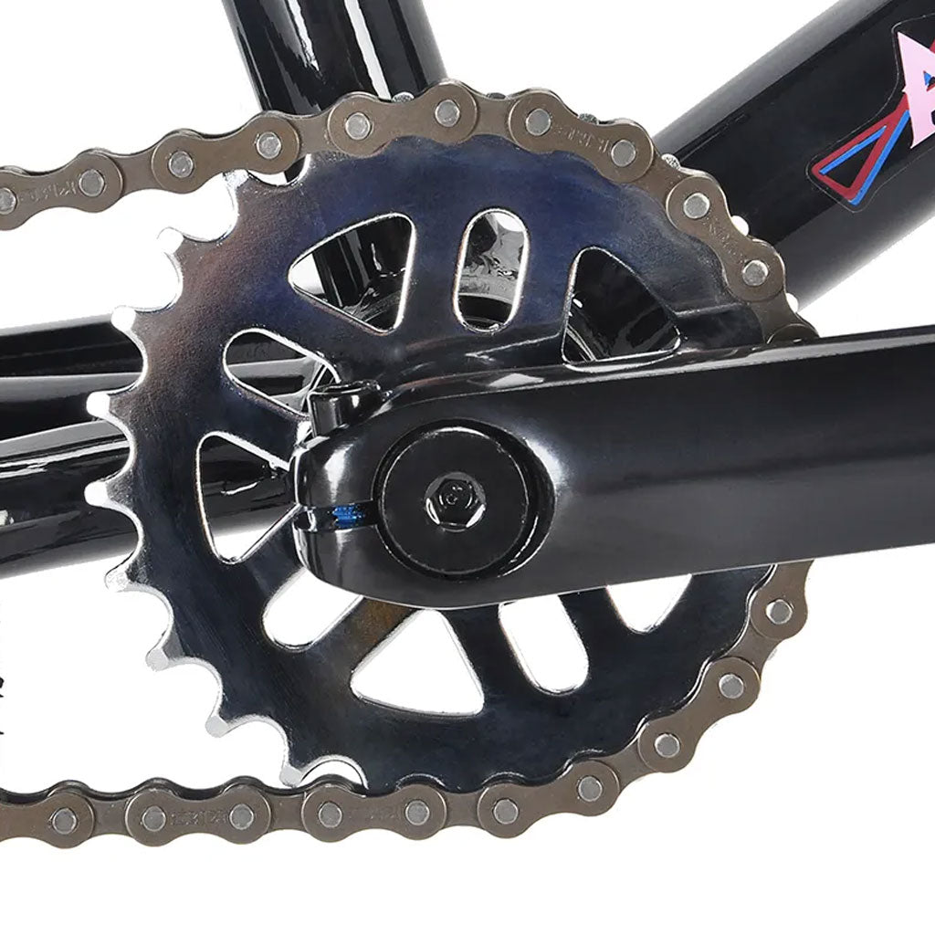 A close up of an Academy Trooper BMX bicycle chain and chainring, featuring sealed mid bottom bracket.