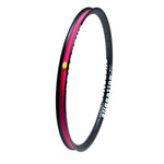 The Alienation Mischief G69 TCS 24 Inch Brakeless Rim features a black exterior adorned with "alienation" text and a vibrant red interior stripe, offering an angled view. Made from G69 material, this rim ensures durability and performance for dedicated cyclists.