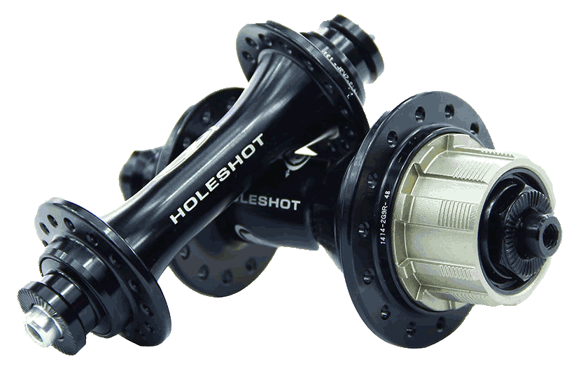 The Answer Holeshot Mini Hub Set 28H in black includes two hubs labeled "HOLESHOT," each with multiple spoke holes and a silver gear attachment. These cassette hubs are engineered with precision sealed bearings to ensure smooth performance.