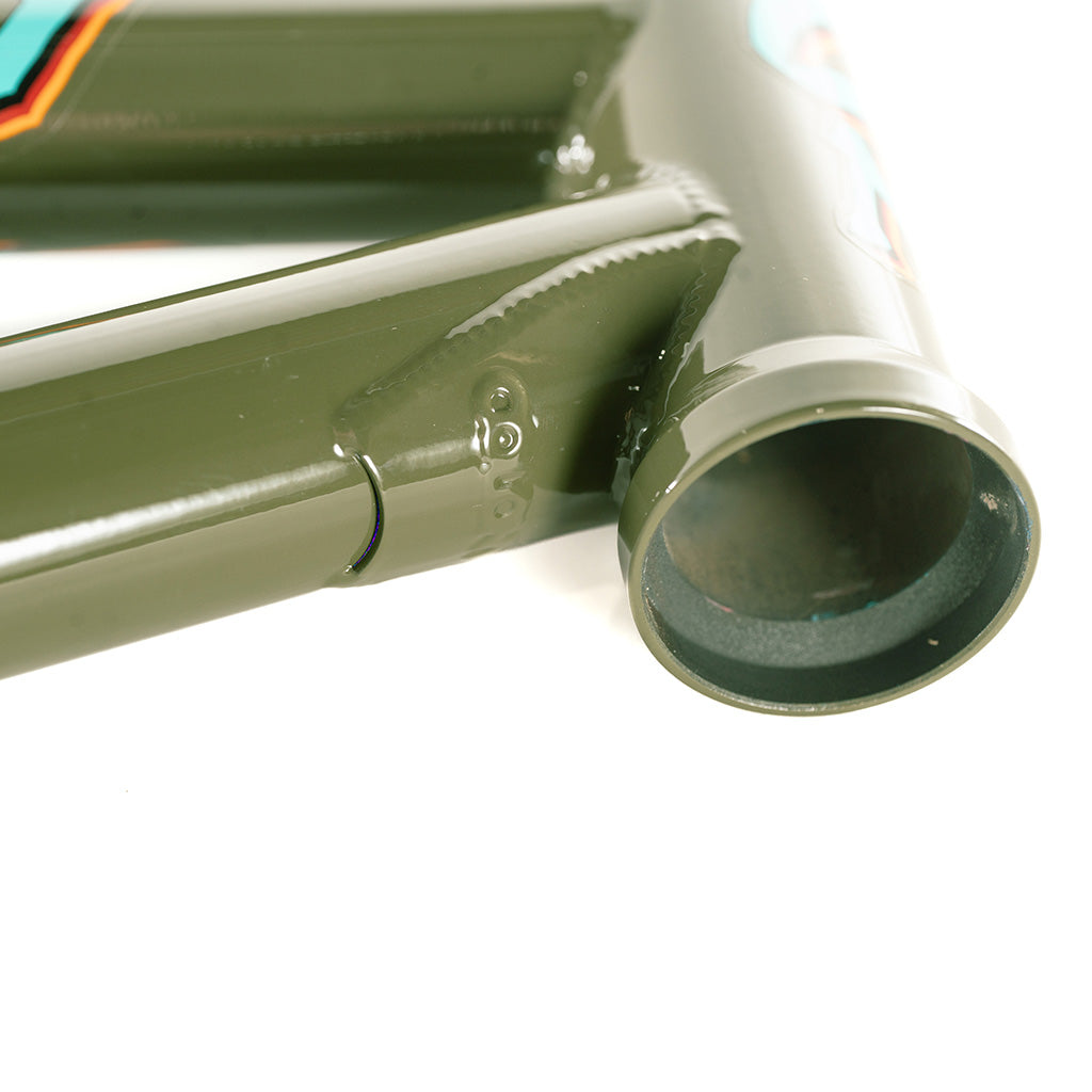 A close up of a green bicycle frame from the Colony 2024 Sweet Tooth Frame brand.