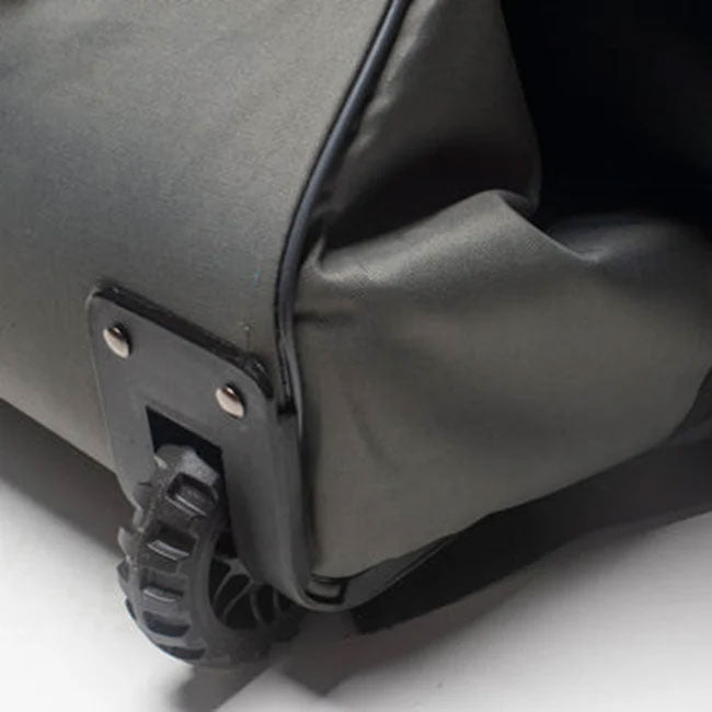Close-up of a damaged wheel and scuffed fabric on the Avian Gilmore V1 Flight Bag, showing clear signs of heavy use—ideal for bike travel.