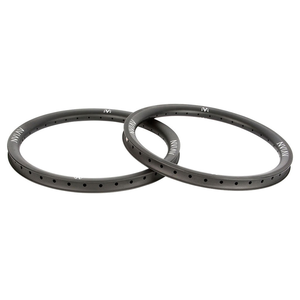 Two Avian Venatic Carbon Brakeless Rims 20x1.75 in black, circular with multiple small holes along the edge, designed as high-strength carbon BMX front rims, showcased on a white background.