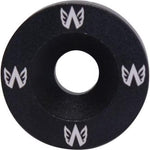 A sleek black circular object with white wings, perfect as a replacement cap for the Avian Versus Fork.
