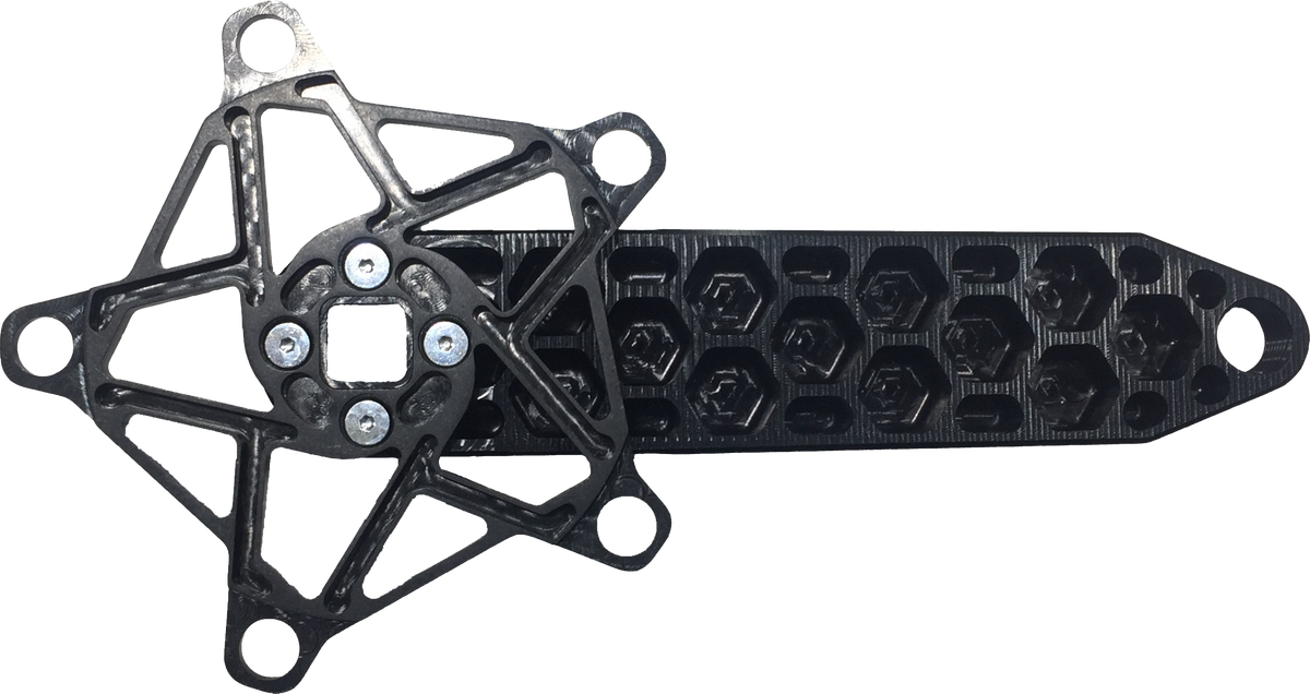 The Rennen Hive Mini Square Tapered Cranks feature a black plastic construction with a geometric star-shaped section connected to a rectangular, honeycomb-patterned arm and secured by four visible screws—making them an ideal lightweight mini crank solution.