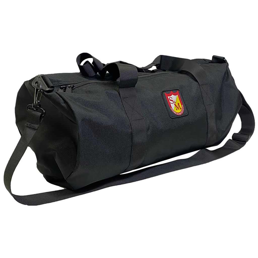 A black S&M Dirtbag Duffel Bag with a crest on it.