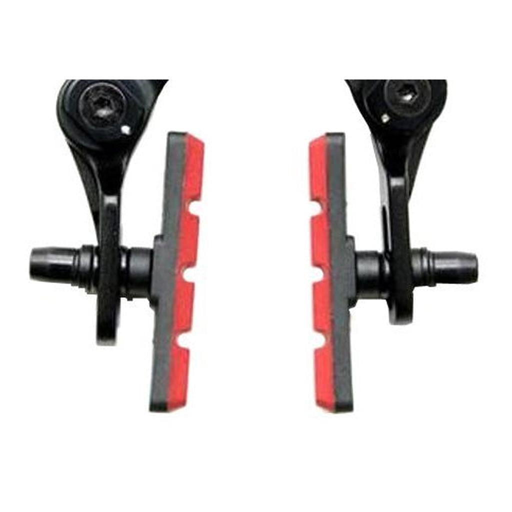 Close-up of two Bicycle Union Brake Pads, black and red, mounted on brake arms and facing each other against a white background.
