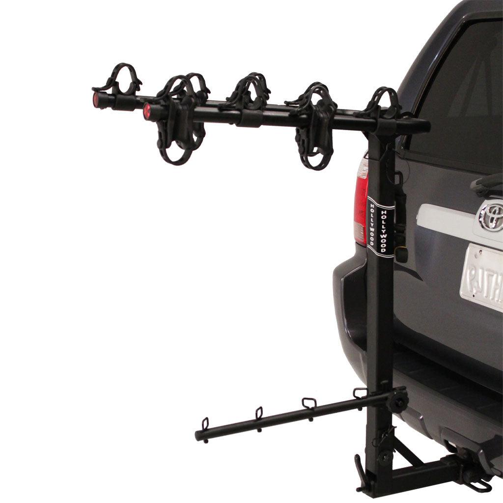 A HOLLYWOOD ROAD RUNNER 4 BIKE HITCH RACK attached to the back of a car.